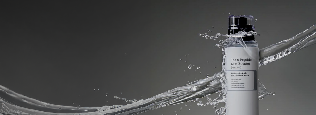 COSRX The 6 Peptide Skin Booster Serum bottle splashing through water on a dark gradient background, text reads '1 Serum, 6 Peptides' and 'Perfect First-Step Booster'; highlights the Korean peptide serum’s hydrating and firming power for youthful glow and healthy aging, ideal for first-step skincare routines.