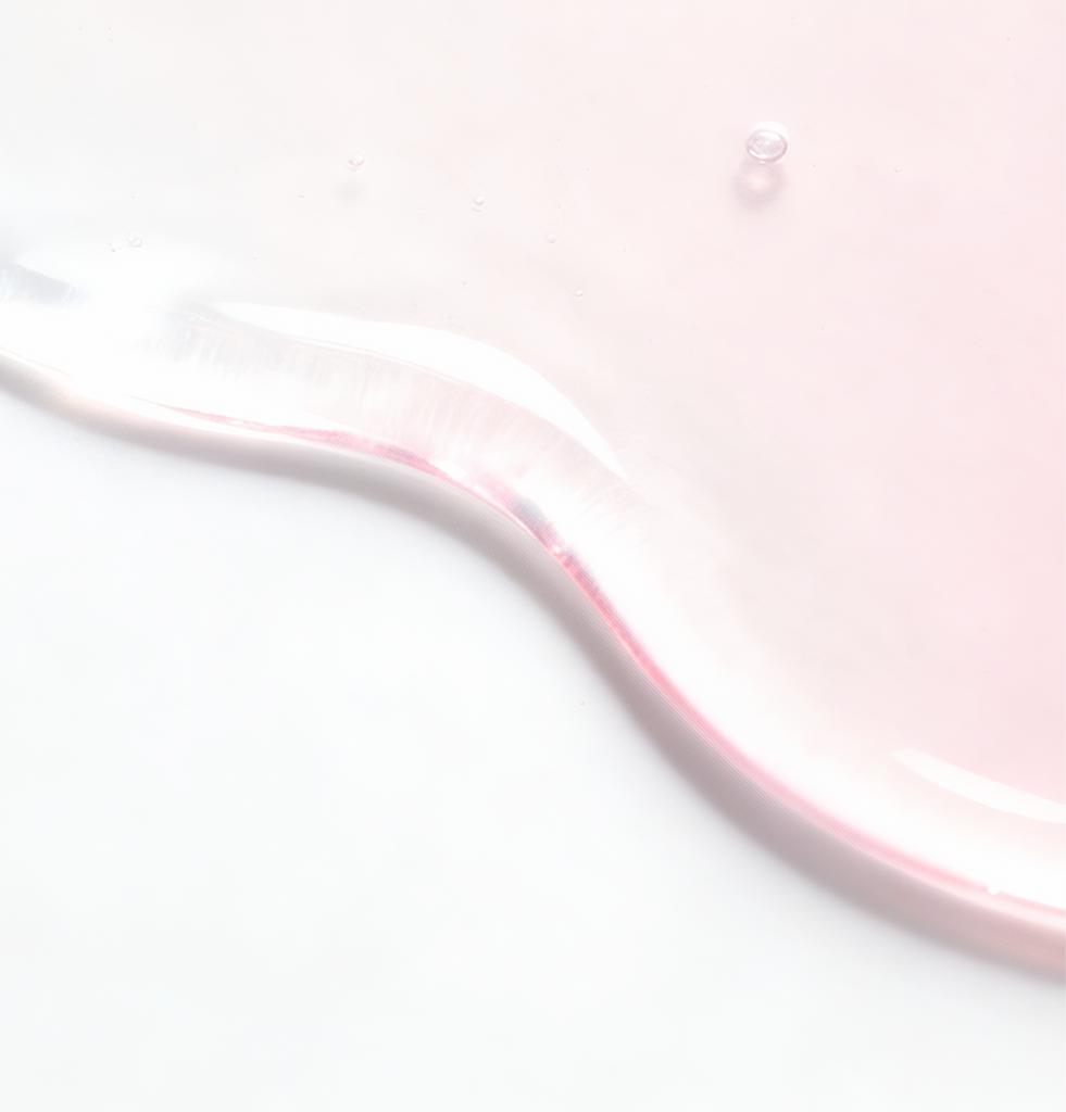 Close-up of COSRX serum texture with soft pink sheen representing Natural Moisturizing Factors and Hyaluronic Acid; highlights lightweight hydrating formula that boosts moisture levels, strengthens the skin barrier, and supports smooth, glowing skin suitable for sensitive and dry skin types.