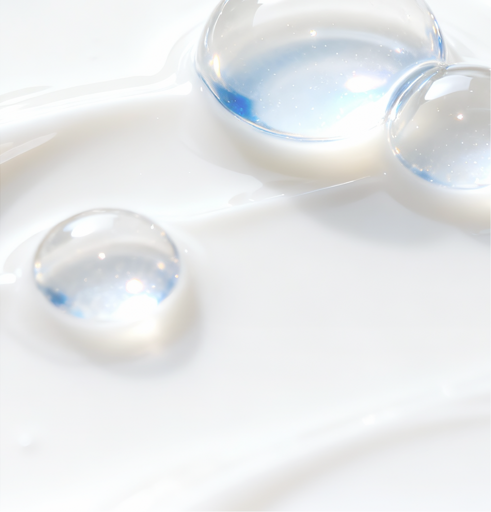 Luminous hydration droplets representing COSRX’s combination of Panthenol and five types of Hyaluronic Acid; illustrating the formula’s ability to keep skin deeply moisturized, maintain long-lasting hydration levels, soothe dryness, and create a plump, smooth, naturally radiant finish suitable for dry and sensitive skin.
