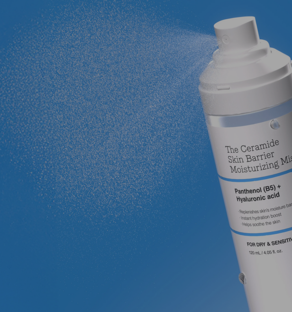 COSRX The Ceramide Skin Barrier Moisturizing Mist bottle spraying fine mist on blue background with text ‘The Ultimate Barrier-Strengthening Solution’; lightweight yet deeply hydrating Korean face mist formulated for dry and sensitive skin to reinforce barrier function and soothe dryness.