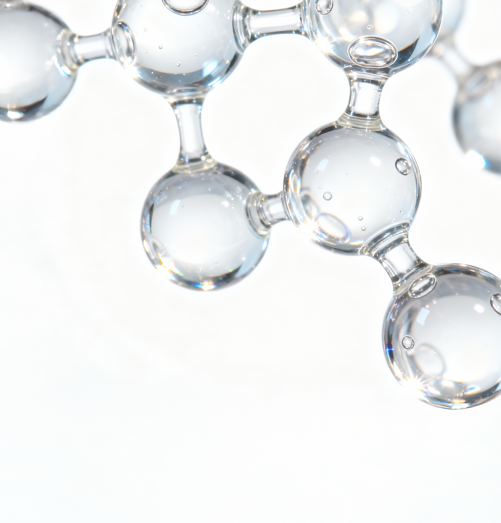 Scientific macro image of serum bubbles with pink hue labeled N-Acetylglucosamine (NAG); illustrates ingredient synergy in COSRX The Niacinamide 15 Serum, enhancing skin clarity, barrier strength, and overall radiance when combined with 15% niacinamide.
