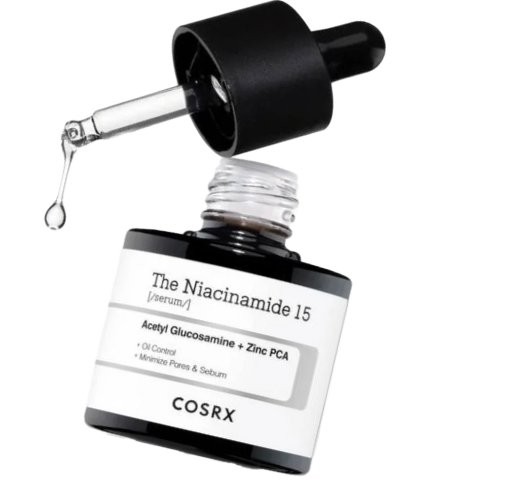 COSRX The Niacinamide 15 Serum bottle with dropper releasing a translucent drop; features 15% niacinamide, Acetyl Glucosamine, and Zinc PCA to target excess oil, uneven tone, and pore congestion with fast-absorbing texture.