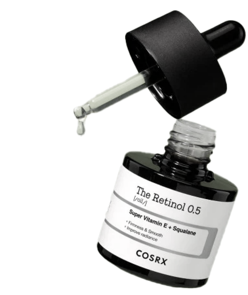 Product image of COSRX The Retinol 0.5 Oil with open dropper releasing a golden drop; 0.5% stabilized pure retinol combined with vitamin E and squalane to boost firmness and reduce aging signs while maintaining hydration for acne-prone or retinol-tolerant skin.