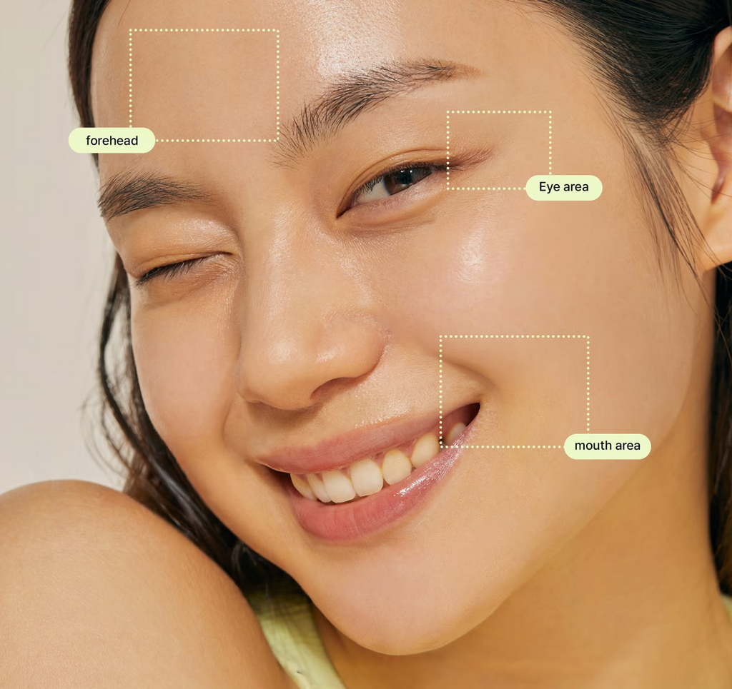 Close-up of smiling woman with radiant skin highlighting forehead, eye area, and mouth area improvements after using COSRX The Retinol 0.5 Oil; visual reference to retinol’s targeted action on wrinkles, elasticity, and fine lines for smoother, youthful-looking skin.