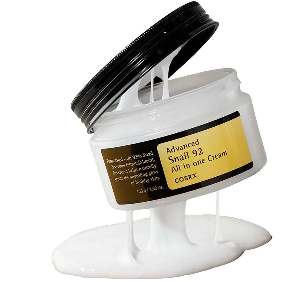 Open jar of COSRX Advanced Snail 92 All In One Cream with rich white texture flowing from lid, highlighting smooth, elastic consistency; contains 92% snail mucin for deep hydration, elasticity boost, and visible barrier repair, increased skin density by 27.35% (A.U), as measured by the Skinscanner.
